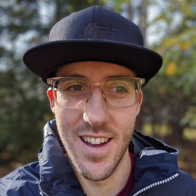 A photo of Brad Touesnard wearing a hat and glasses.