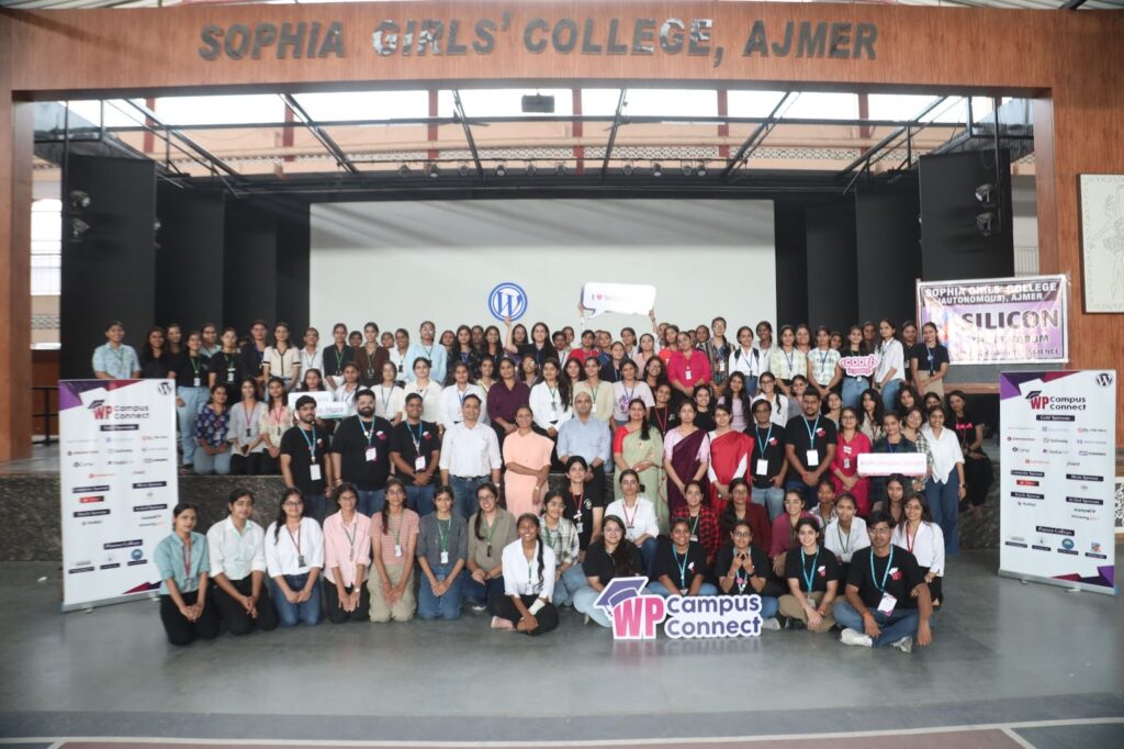 A large group of people poses for a photo at Sophia Girls' College, Ajmer.