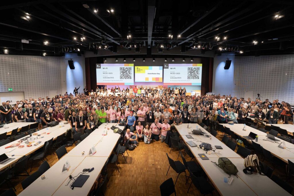 A large group of people gathered in a conference hall for an event.